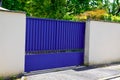 Blue classic portal of vintage house gate door to access garage home