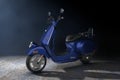Blue Classic Vintage Retro or Electric Scooter in the Volumetric Light. 3d Rendering