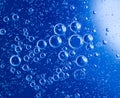 Blue clean water drop bubbles close-up background