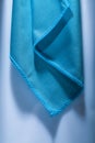 Blue cleaning cloth on white surface Royalty Free Stock Photo