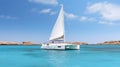 Luxurious White Sailboat Floating In Turquoise Sea