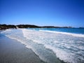 The blue clear water and white sand of a beach in Sardinia Royalty Free Stock Photo