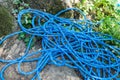 Blue Climbing Rope on the rock. Climbing equipment Royalty Free Stock Photo