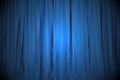 Blue closed the curtain, lit by a spotlight