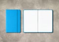 Blue closed and open lined notebooks on concrete background Royalty Free Stock Photo