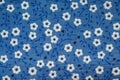 Blue cloth texture background with white flowers striped Royalty Free Stock Photo