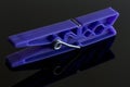 Blue clothespin on black Royalty Free Stock Photo