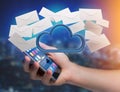 Blue cloud surrounded by realistic envelope email displayed on a Royalty Free Stock Photo