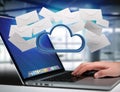 Blue cloud surrounded by realistic envelope email displayed on a Royalty Free Stock Photo