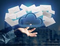Blue cloud surrounded by realistic envelope email displayed on a Royalty Free Stock Photo