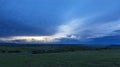 Blue clouds and green grass