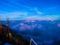 Blue clouds over mountains in evening shadow