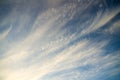 Blue cloudy sky with clouds unusual shapes.