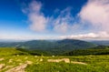 Blue cloudy sky over the mountains with rocky hillside Royalty Free Stock Photo