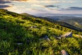 Blue cloudy sky over the mountains with rocky hillside Royalty Free Stock Photo