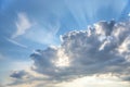 Blue cloudy sky, sun rays break through the clouds, background with sun flare, place for text Royalty Free Stock Photo