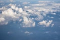 Blue cloudy sky, view from the airplane window. Aerial view of cloudscape Royalty Free Stock Photo