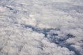 Blue cloudy sky, view from the airplane window. Aerial view of cloudscape Royalty Free Stock Photo