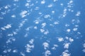 Blue cloudy sky, view from the airplane window. Aerial view of cloudscape, abstract background Royalty Free Stock Photo