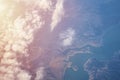 Blue cloudy sky, view from the airplane window. Aerial view of cloudscape Royalty Free Stock Photo