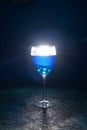 Blue cocktail on the black background