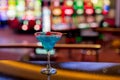 Blue cocktail on casino bar. Cocktail with cherry. Royalty Free Stock Photo