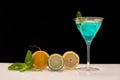 Blue cocktail glass with fruits. Royalty Free Stock Photo