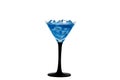 Blue cocktail in a glass for martini with ice isolated on a white background. Blue cocktail with martini on a white background. Royalty Free Stock Photo