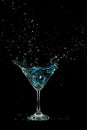 Blue Cocktail Glass with splashing water alcohol, Crystal Cocktail drink splatter splash in air and bubble from glass. Liquor Part Royalty Free Stock Photo