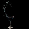 Blue Cocktail Glass with splashing water alcohol, Crystal Cocktail drink splatter splash in air and bubble from glass. Liquor Part Royalty Free Stock Photo