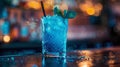 Blue cocktail with ice and mint on a bar counter in a nightclub Royalty Free Stock Photo