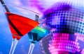 Blue cocktail with sparkling disco ball background with space for text Royalty Free Stock Photo