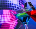 Blue cocktail with sparkling disco ball background with space for text selected focus Royalty Free Stock Photo