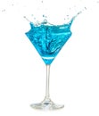 Blue cocktail splashing in martini glass Royalty Free Stock Photo