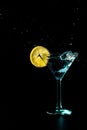 Blue cocktail water drink splash in the glass with lemon Isolated on black Royalty Free Stock Photo