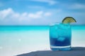 Blue cocktail on the white sand of a paradisiacal beach with the sea in the background. Copy space. Ai generative