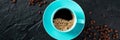 Blue coffee cup and coffee beans panorama, overhead flat lay shot on black Royalty Free Stock Photo