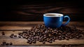 A blue coffee cup full of black coffee on a wood background with coffee beans Royalty Free Stock Photo