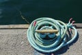 Blue coiled rope in the dock Royalty Free Stock Photo