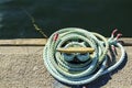 Blue coiled rope in the dock Royalty Free Stock Photo