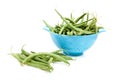 Blue colander with long green beans