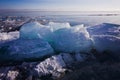 Blue and cold ice of Lake Baikal. Hummocks and heaps of ice