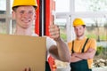 Blue-collar worker showing thumbs up sign Royalty Free Stock Photo