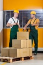 Blue-collar worker talking with his collaborator Royalty Free Stock Photo