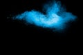 Blue color background of chalk powder. Blue color dust particles splattered on black background Royalty Free Stock Photo