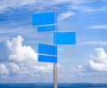 Blue color blank signs against blue sky Royalty Free Stock Photo