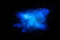 Blue color dust particle explosion cloud on black background.Color powder splash Royalty Free Stock Photo