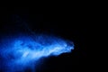 Blue color dust particles explosion cloud on black background.Color powder splash