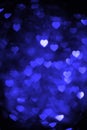 Blue color heart bokeh background photo. Abstract holiday, celebration backdrop. Royalty Free Stock Photo