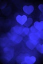 Blue color heart bokeh background photo. Abstract holiday, celebration backdrop. Royalty Free Stock Photo